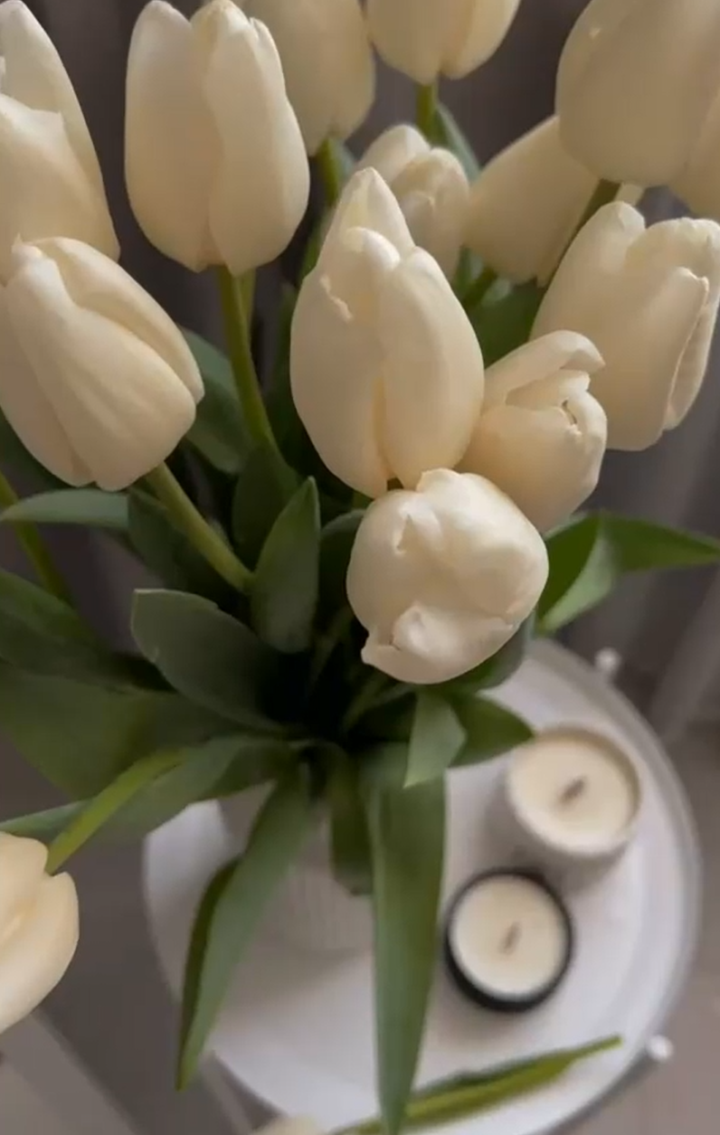 Arranging white tulips in a minimal vase