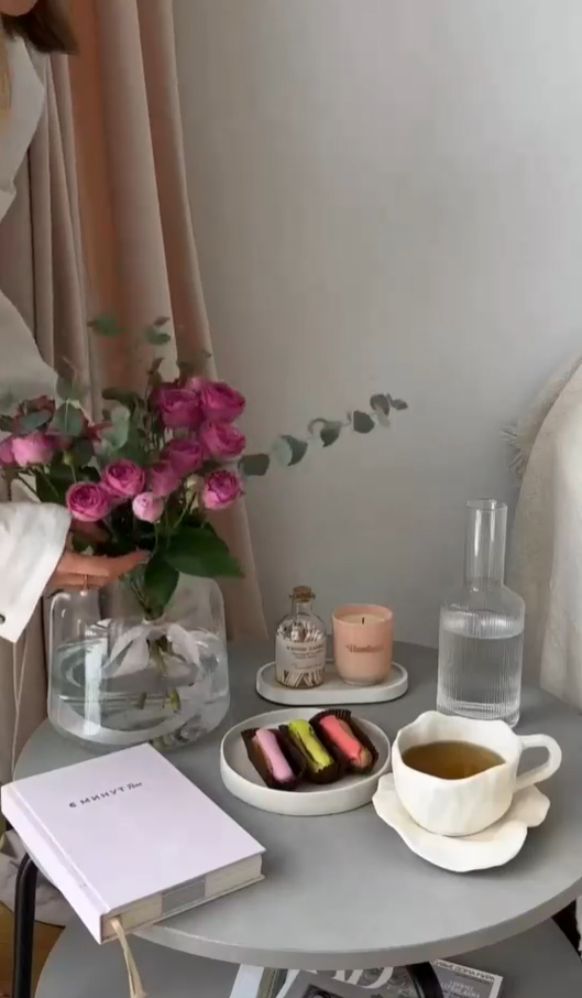 Tea time with bakery treats rose bouquet and candles