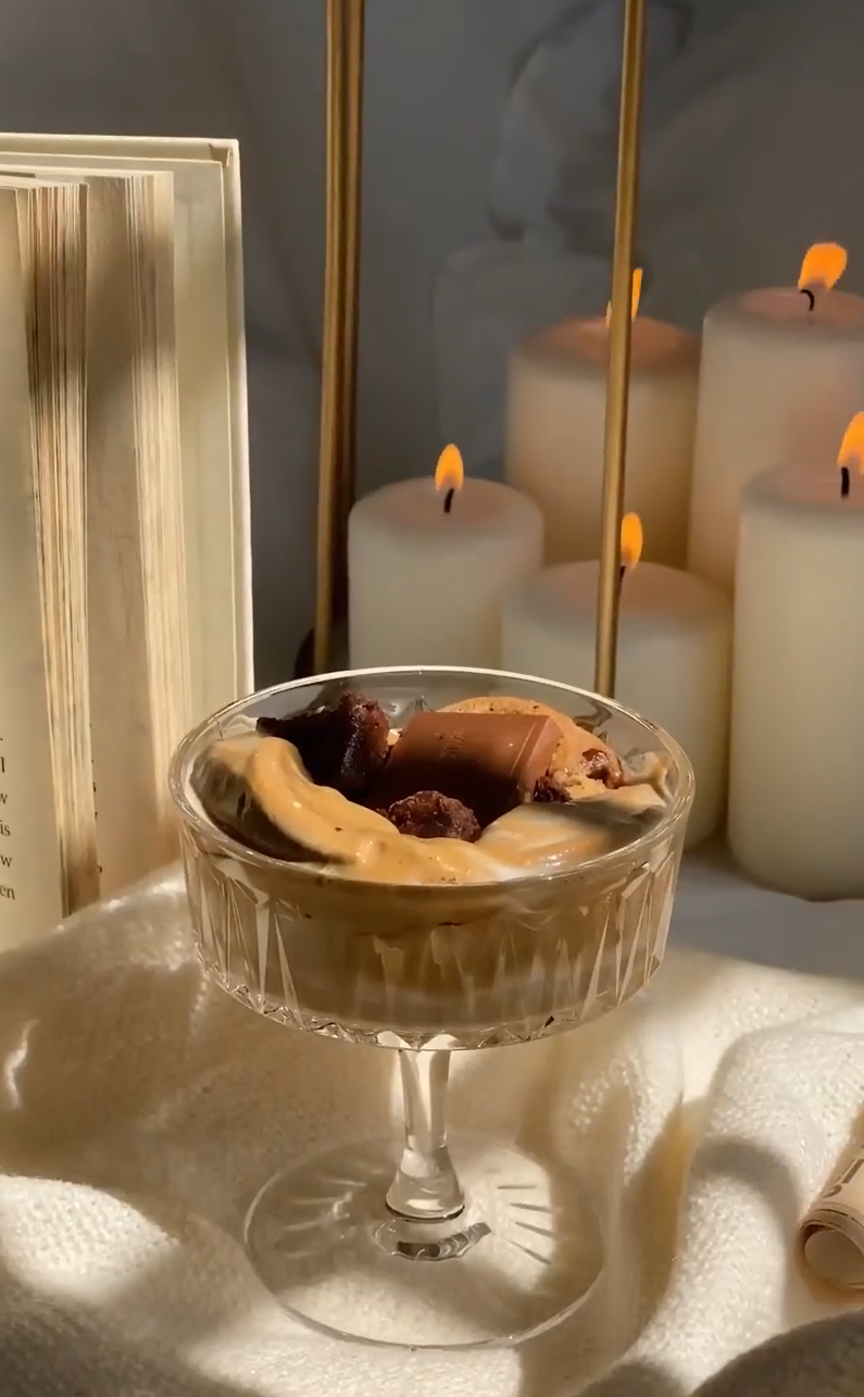 milk and cookies dessert with candles in background